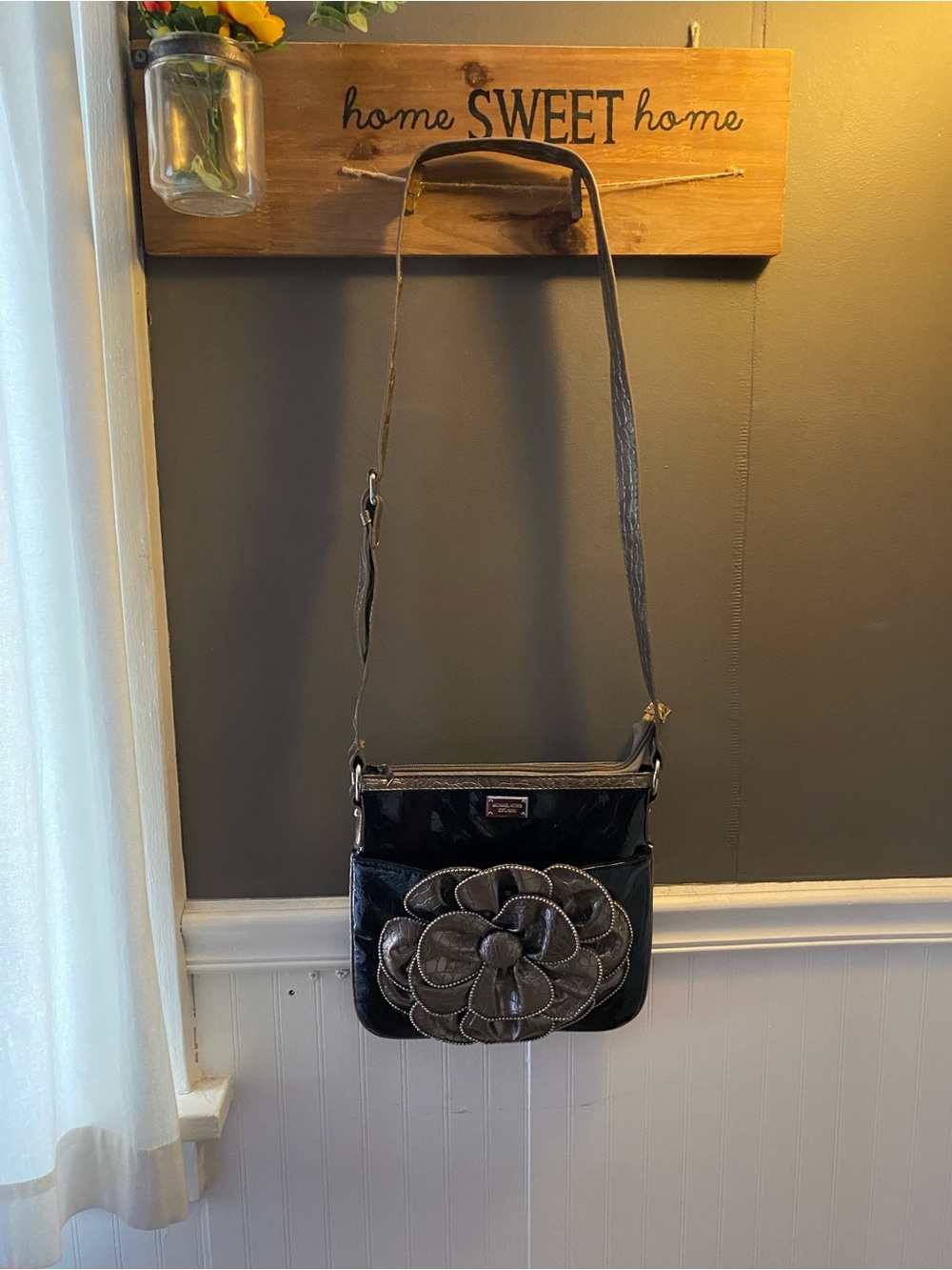 Michael Kors Black Crossbody Bag with Metallic Floral Accent